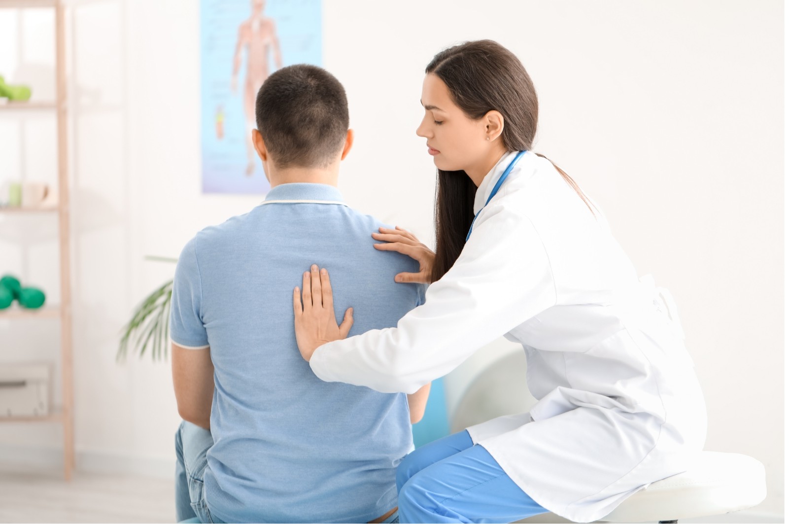 physiotherapist correcting posture
